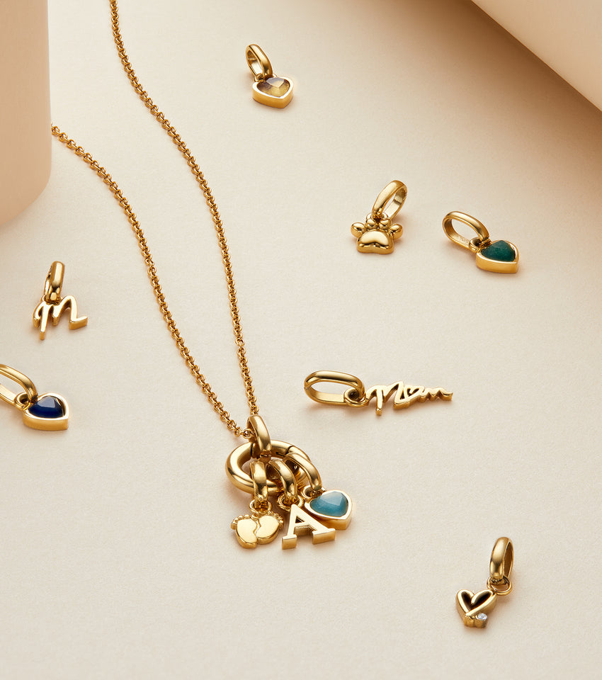 Gold jewellery pendant with earring set Stock Photo - Alamy